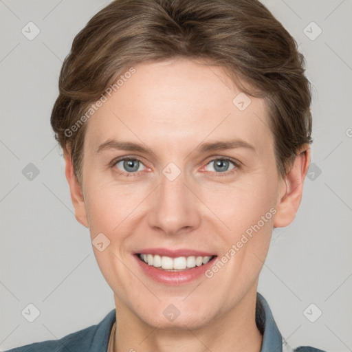 Joyful white young-adult female with short  brown hair and grey eyes