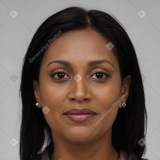 Joyful black young-adult female with long  brown hair and brown eyes