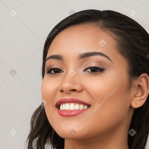 Joyful white young-adult female with long  black hair and brown eyes