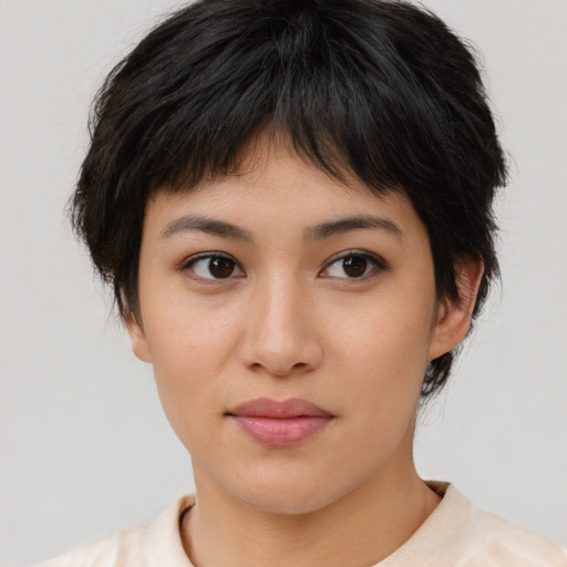 Joyful asian young-adult female with medium  brown hair and brown eyes