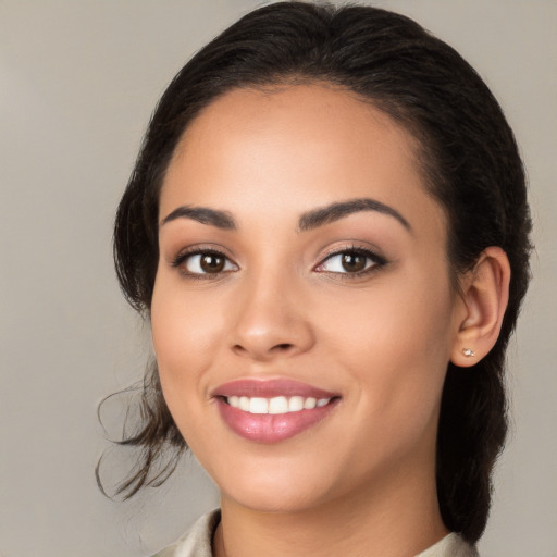 Joyful white young-adult female with medium  brown hair and brown eyes