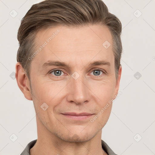 Joyful white adult male with short  brown hair and grey eyes