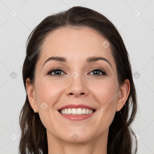 Joyful white young-adult female with long  brown hair and grey eyes