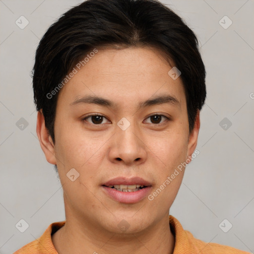 Joyful asian young-adult male with short  brown hair and brown eyes