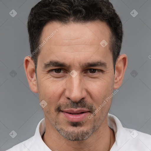 Joyful white adult male with short  brown hair and brown eyes