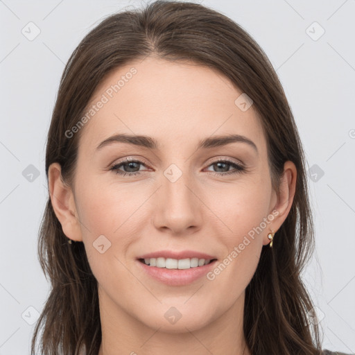 Joyful white young-adult female with long  brown hair and grey eyes