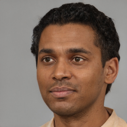 Neutral black young-adult male with short  black hair and brown eyes