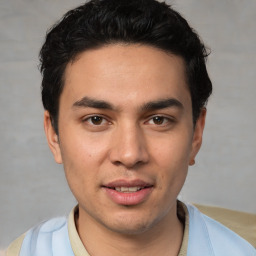 Joyful white young-adult male with short  black hair and brown eyes