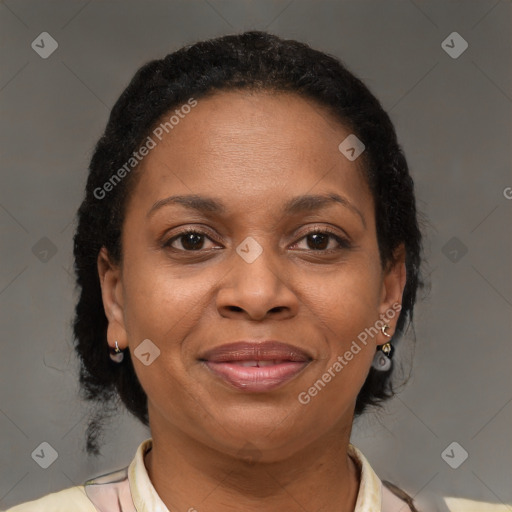 Joyful black adult female with medium  brown hair and brown eyes