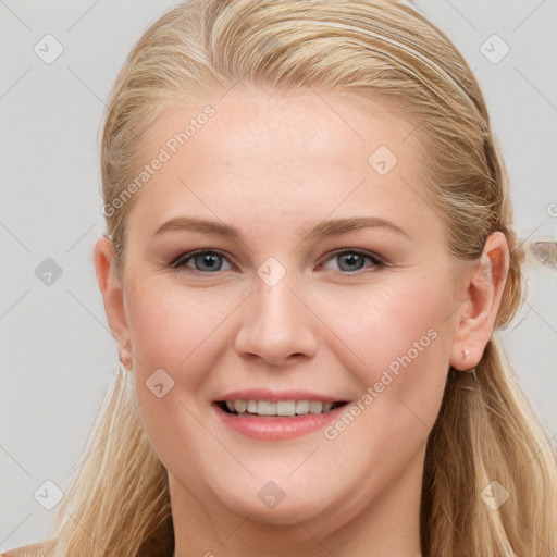 Joyful white young-adult female with long  brown hair and blue eyes