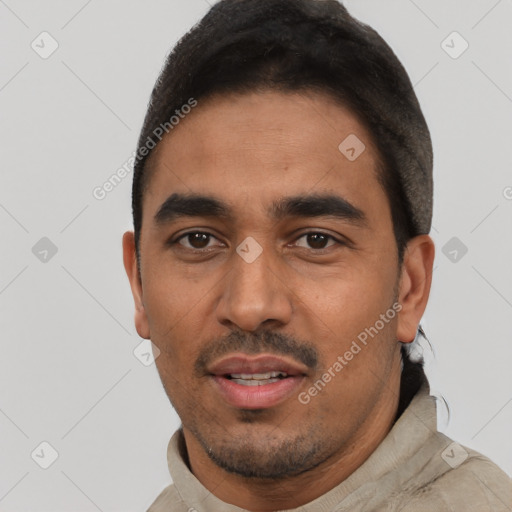 Neutral latino young-adult male with short  black hair and brown eyes