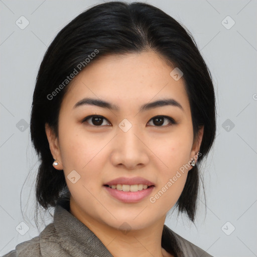 Joyful asian young-adult female with medium  black hair and brown eyes