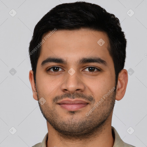 Joyful latino young-adult male with short  black hair and brown eyes