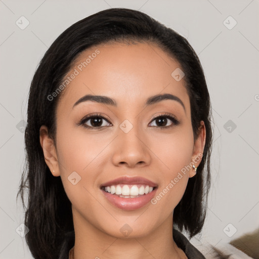 Joyful white young-adult female with long  black hair and brown eyes