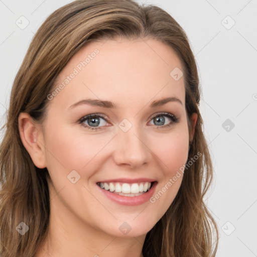 Joyful white young-adult female with long  brown hair and blue eyes