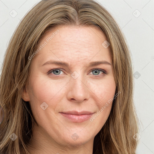 Joyful white adult female with long  brown hair and green eyes