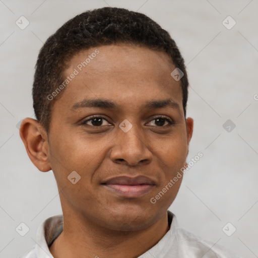 Joyful latino young-adult male with short  brown hair and brown eyes