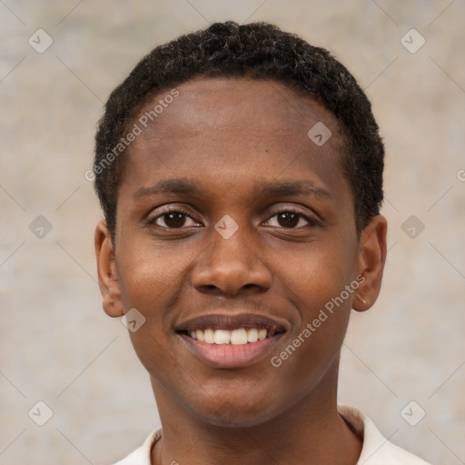 Joyful black young-adult male with short  brown hair and brown eyes