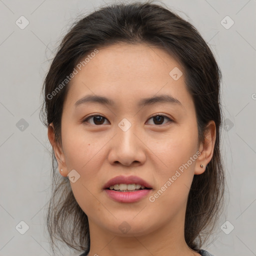 Joyful asian young-adult female with medium  brown hair and brown eyes