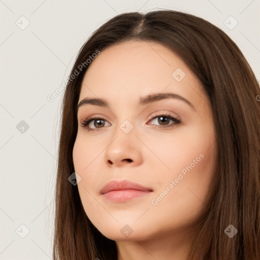 Neutral white young-adult female with long  brown hair and brown eyes