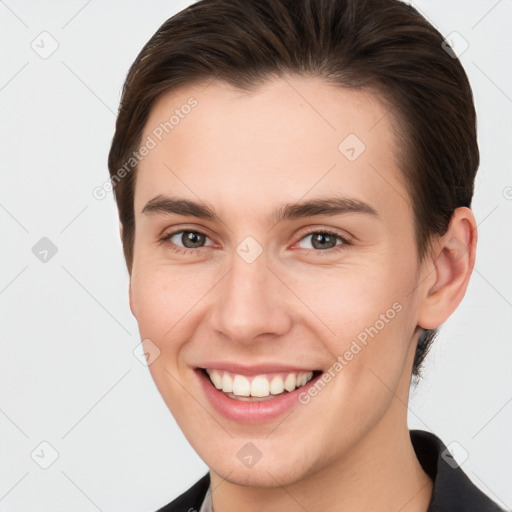 Joyful white young-adult female with short  brown hair and brown eyes