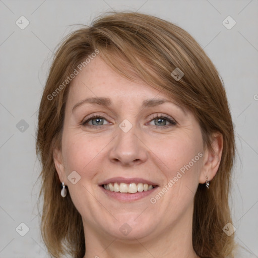 Joyful white adult female with medium  brown hair and grey eyes