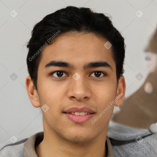 Joyful latino young-adult male with short  brown hair and brown eyes