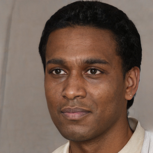 Neutral black young-adult male with short  black hair and brown eyes