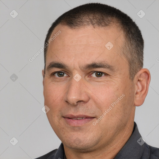 Joyful white adult male with short  brown hair and brown eyes