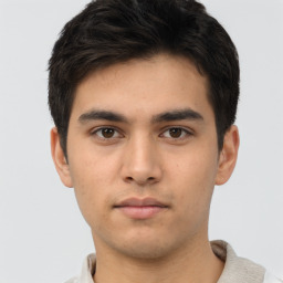 Neutral asian young-adult male with short  brown hair and brown eyes