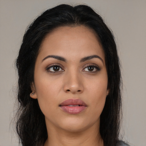 Neutral latino young-adult female with long  brown hair and brown eyes