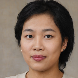 Joyful asian young-adult female with medium  black hair and brown eyes