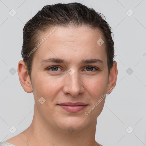 Joyful white young-adult female with short  brown hair and grey eyes