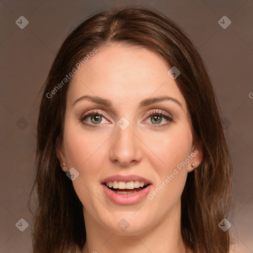 Joyful white young-adult female with long  brown hair and green eyes