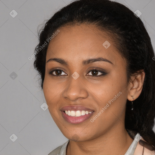 Joyful black young-adult female with medium  black hair and brown eyes