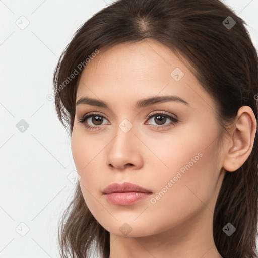 Neutral white young-adult female with long  brown hair and brown eyes