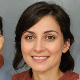 Joyful white adult female with medium  brown hair and brown eyes