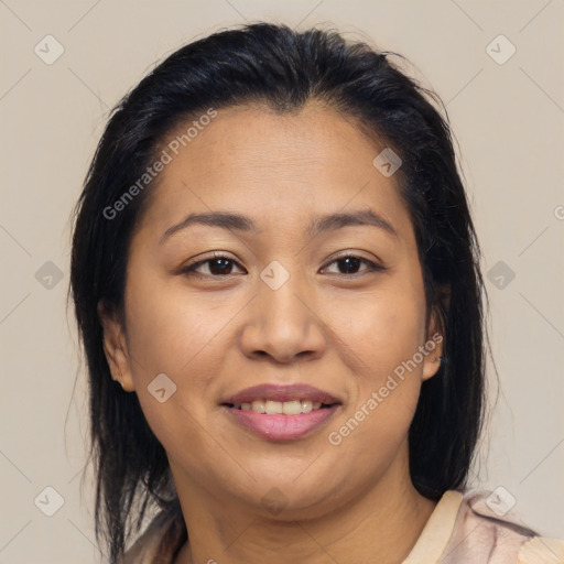 Joyful latino young-adult female with medium  brown hair and brown eyes