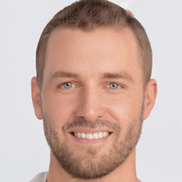 Joyful white young-adult male with short  brown hair and grey eyes