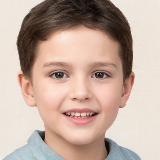 Joyful white child male with short  brown hair and brown eyes