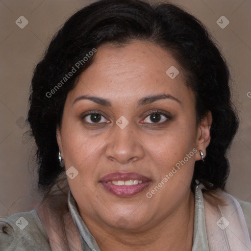 Joyful latino adult female with medium  brown hair and brown eyes