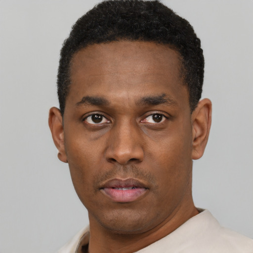 Neutral black young-adult male with short  black hair and brown eyes