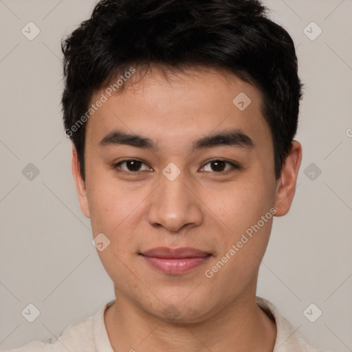 Joyful asian young-adult male with short  brown hair and brown eyes