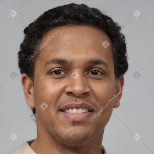 Joyful latino adult male with short  brown hair and brown eyes