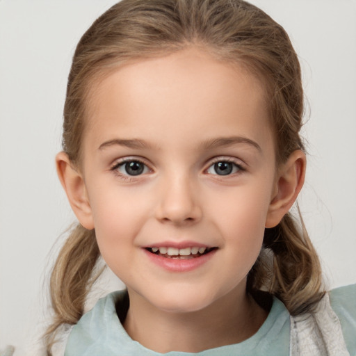 Joyful white child female with medium  brown hair and brown eyes