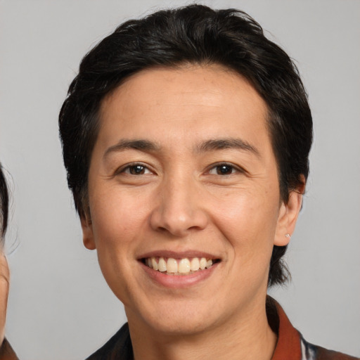 Joyful white young-adult male with medium  brown hair and brown eyes