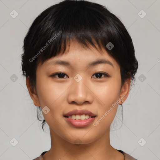 Joyful asian young-adult female with short  brown hair and brown eyes