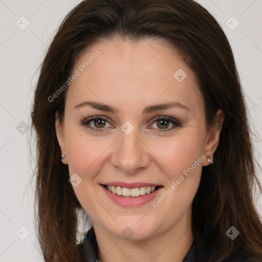 Joyful white adult female with long  brown hair and brown eyes