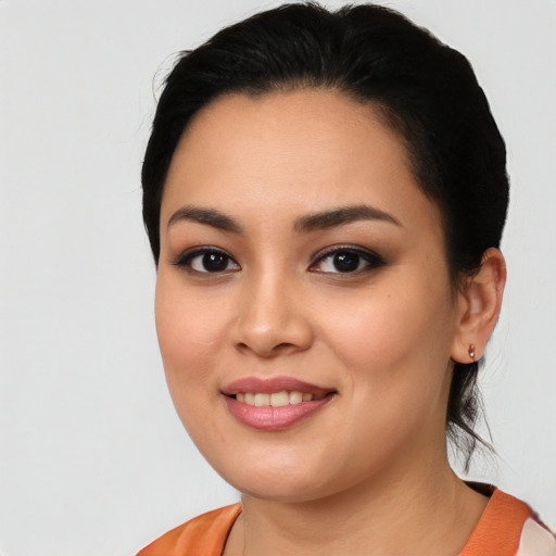 Joyful asian young-adult female with medium  black hair and brown eyes