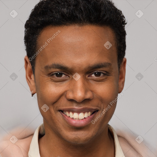 Joyful black young-adult male with short  brown hair and brown eyes